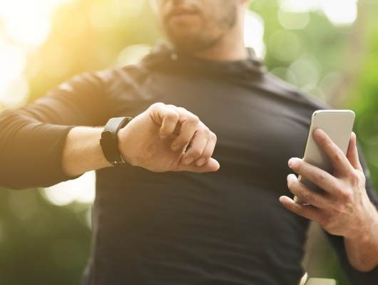 man checking digital health smartwatch
