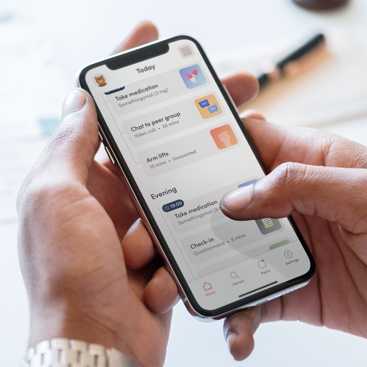 phone of hands holding a phone with and scrolling through an app
