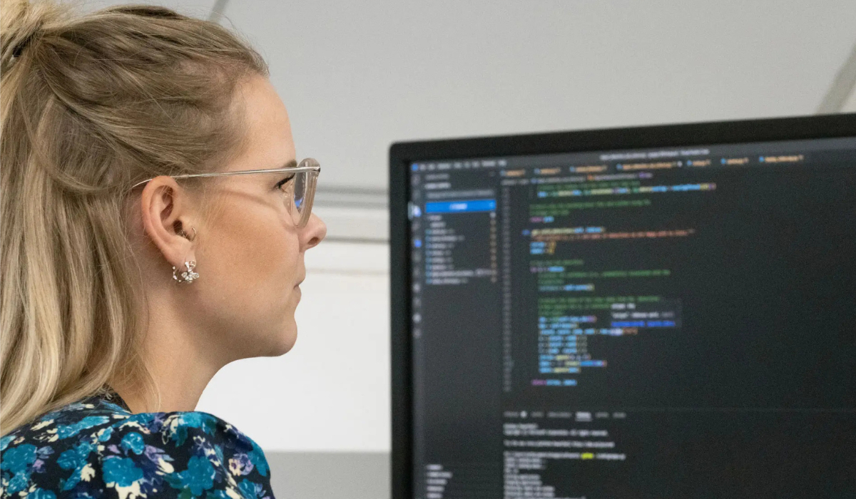 Women coding at desk