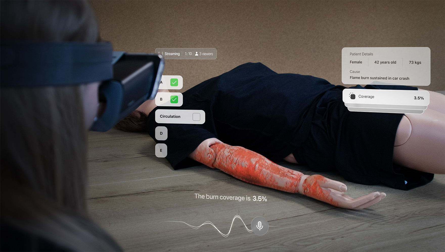Person wearing mixed reality headset looking at a mannequin with simulated burns on arm banner image